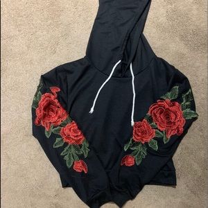 Black crop top hooded with red flower appliqués